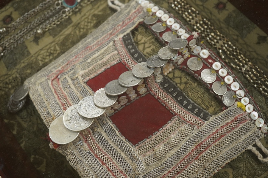 A framed Omani tribe wedding veil, 45 x 62cm. Condition - good